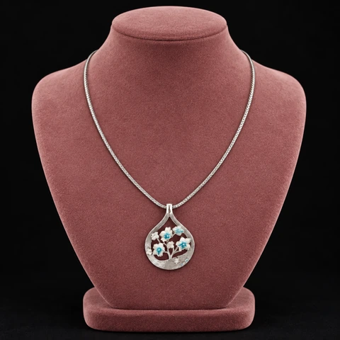 The Mirabelle Silver-Tone Necklace on a jewelry display — AI-generated styling preview