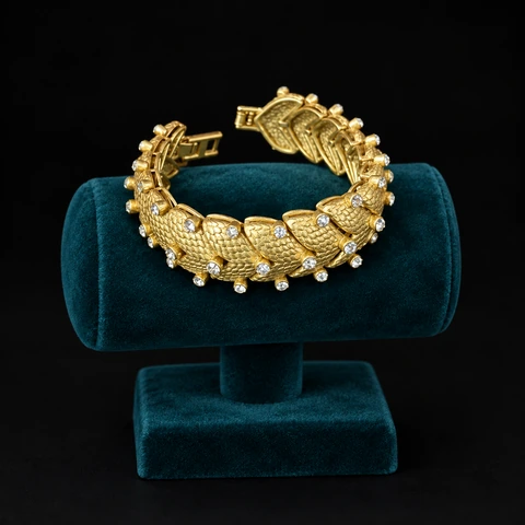The Gabrielle Romance Bracelet on a jewelry display — AI-generated styling preview