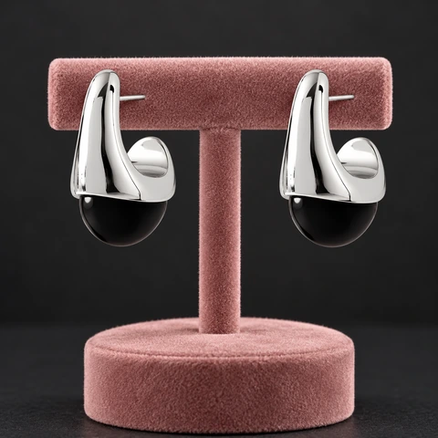 The Aurore Sonnet Black Earrings on a jewelry display — AI-generated styling preview