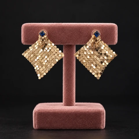 The Jeanne Promenade Earrings on a jewelry display — AI-generated styling preview