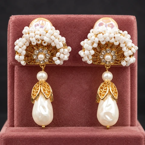 The Isolde Muse Earrings on a jewelry display — AI-generated styling preview