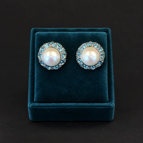 The Louise Fleur Blue Earrings on a jewelry display — AI-generated styling preview